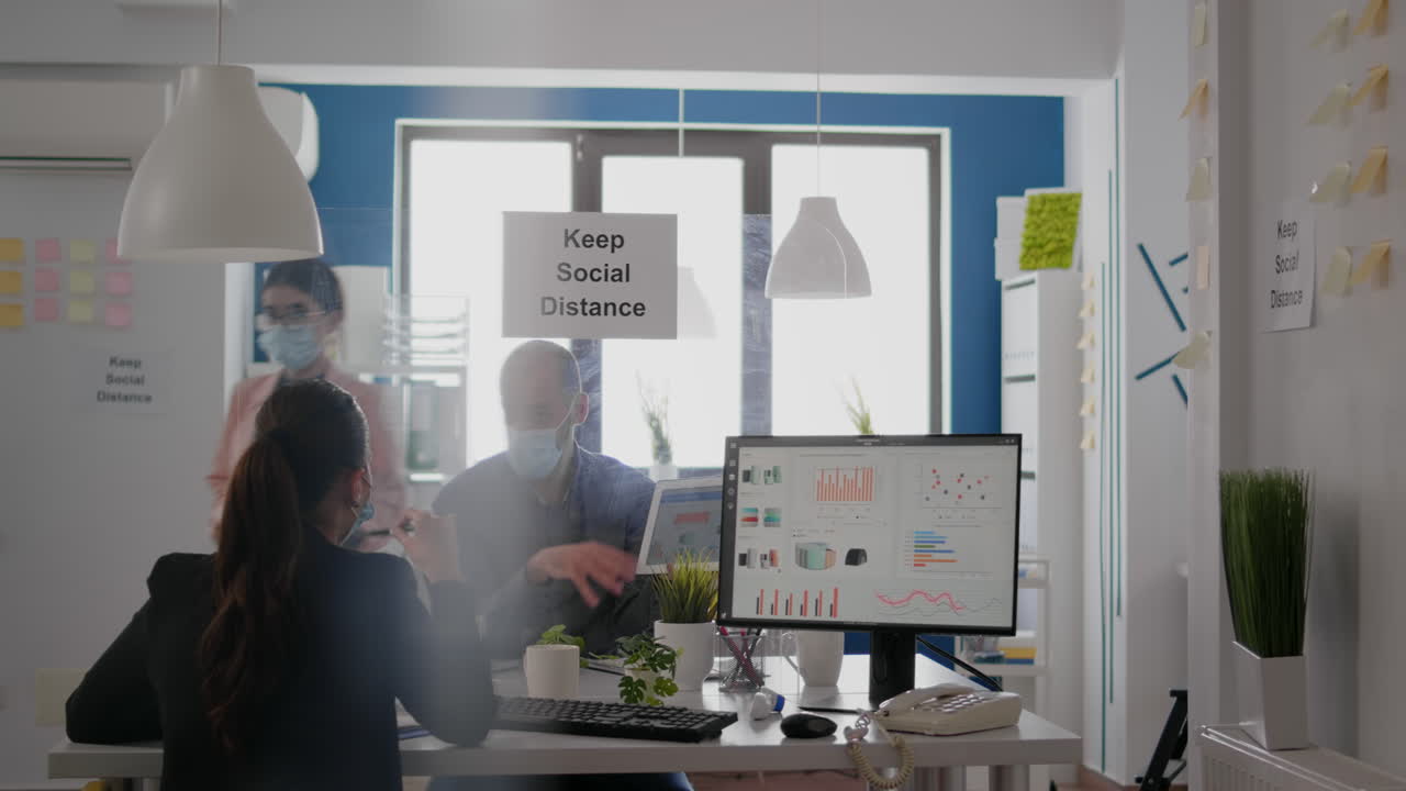 Business people working at financial graphs using digital tablet