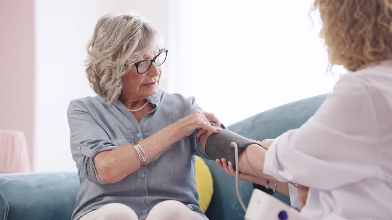 Elderly Woman Having Her Blood Pressure Checked by a Nurse