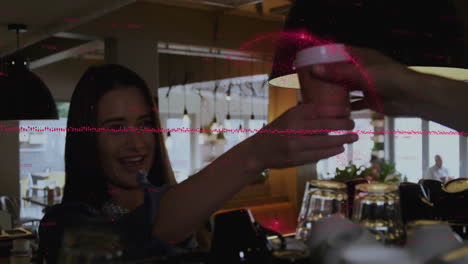 woman reaching for coffee from barista in business cafe, showing red digital data overlay graphics