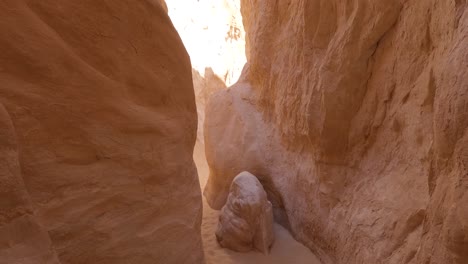 first person view of sandy rocky colored canyon in south sinai desert, egypt