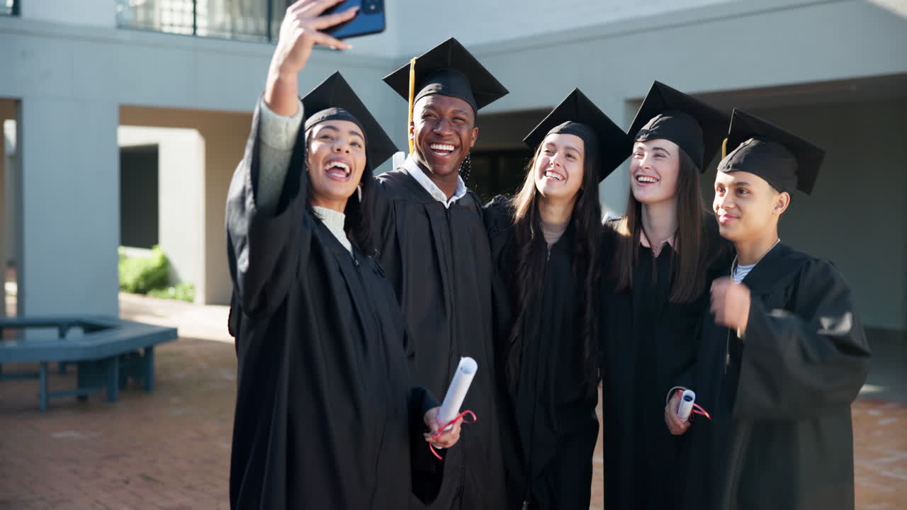 Graduating students celebrating with a selfie
