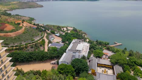 Drone-footage-of-the-Luo-Quan-Tower-Panning-to-Er-Hai-in-Dali,-Yunnan,-China