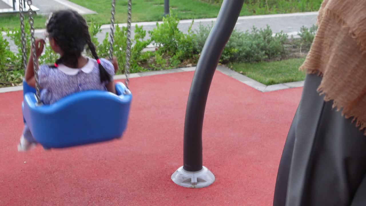 Child on a Swing in a Park