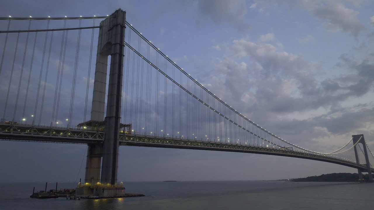 Aerial view of the Verrazzano-Narrows Bridge at night. Shot in Brooklyn looking towards Staten Island