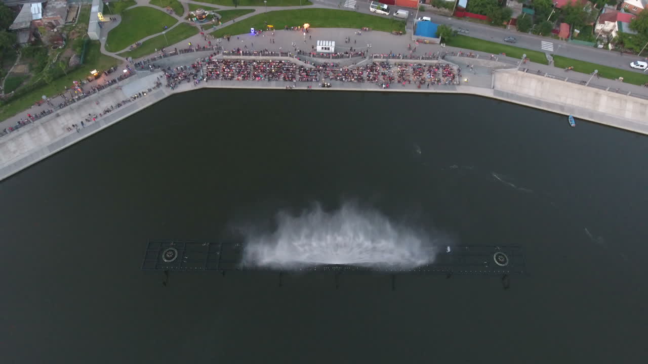 Dancing Water Fountain Show. Aerial shot of the musical fountain with colorful illuminations at night