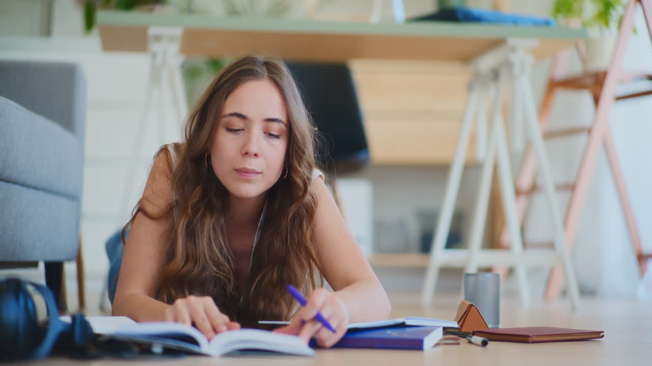 Woman Studying on Floor at Home