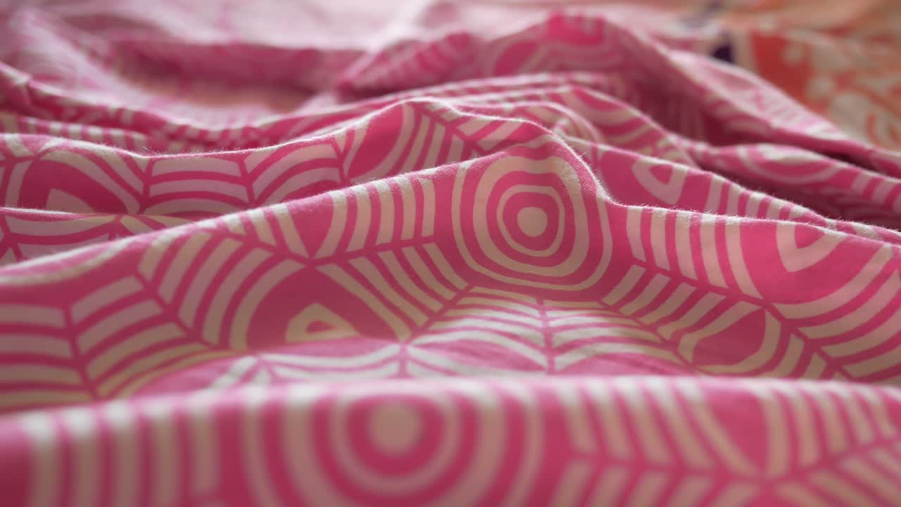 Closeup of Pink and White Patterned Bedding