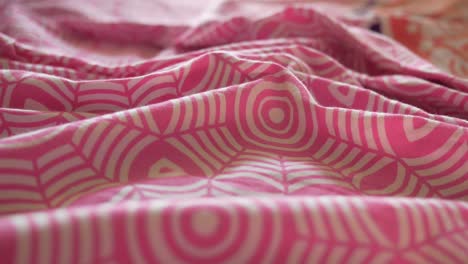 closeup of pink and white patterned bedding