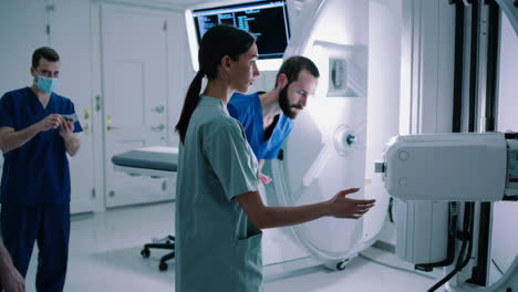 medical staff operating diagnostic imaging equipment