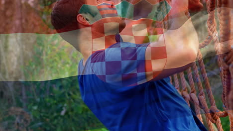 animación de la bandera de croacia sobre un hombre musculoso y fuerte haciendo flexiones