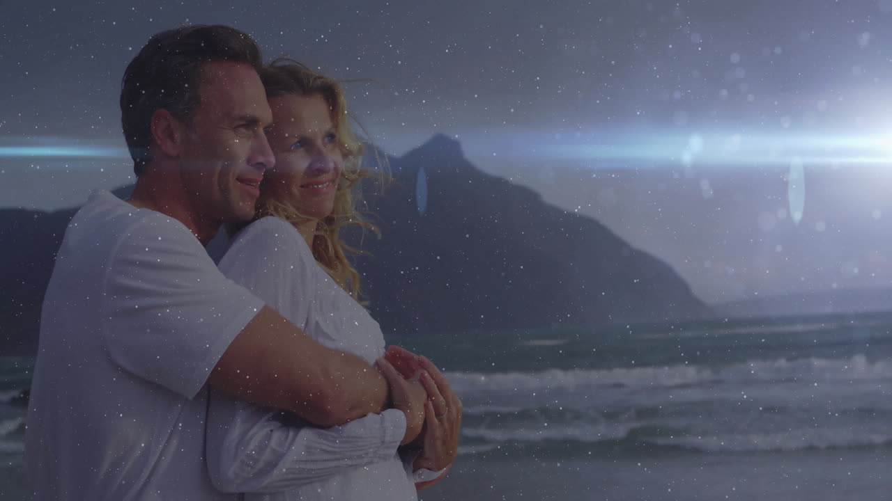 Embracing on beach, couple with mountain and ocean under starry night animation