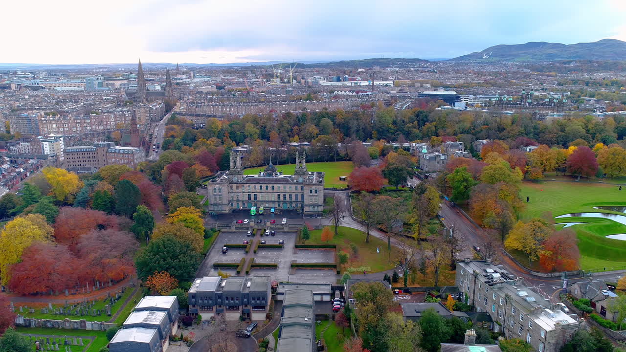 Aerial track from left to right looking over the city skyline of Edinburgh and Stewart's Melville College