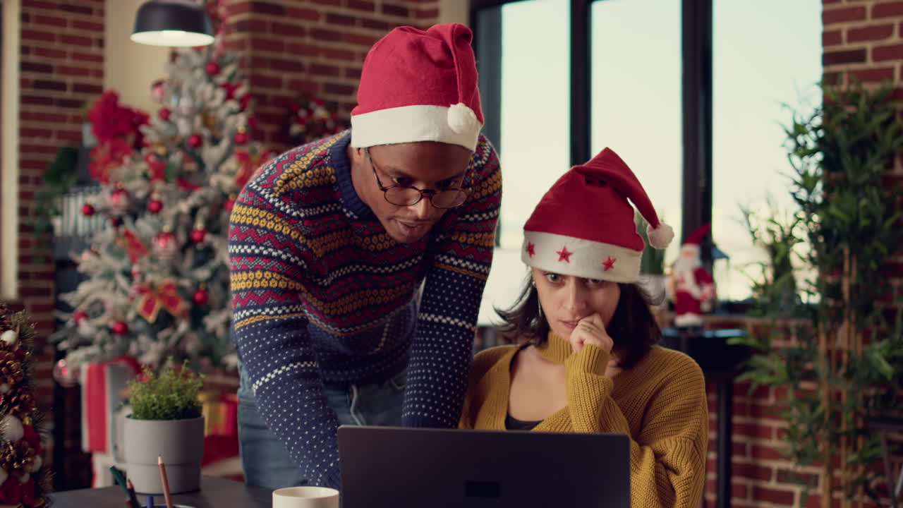 Diverse team of colleagues analyzing data in festive office