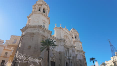 historic cathedral with baroque architecture under blue sky, cadiz, spain