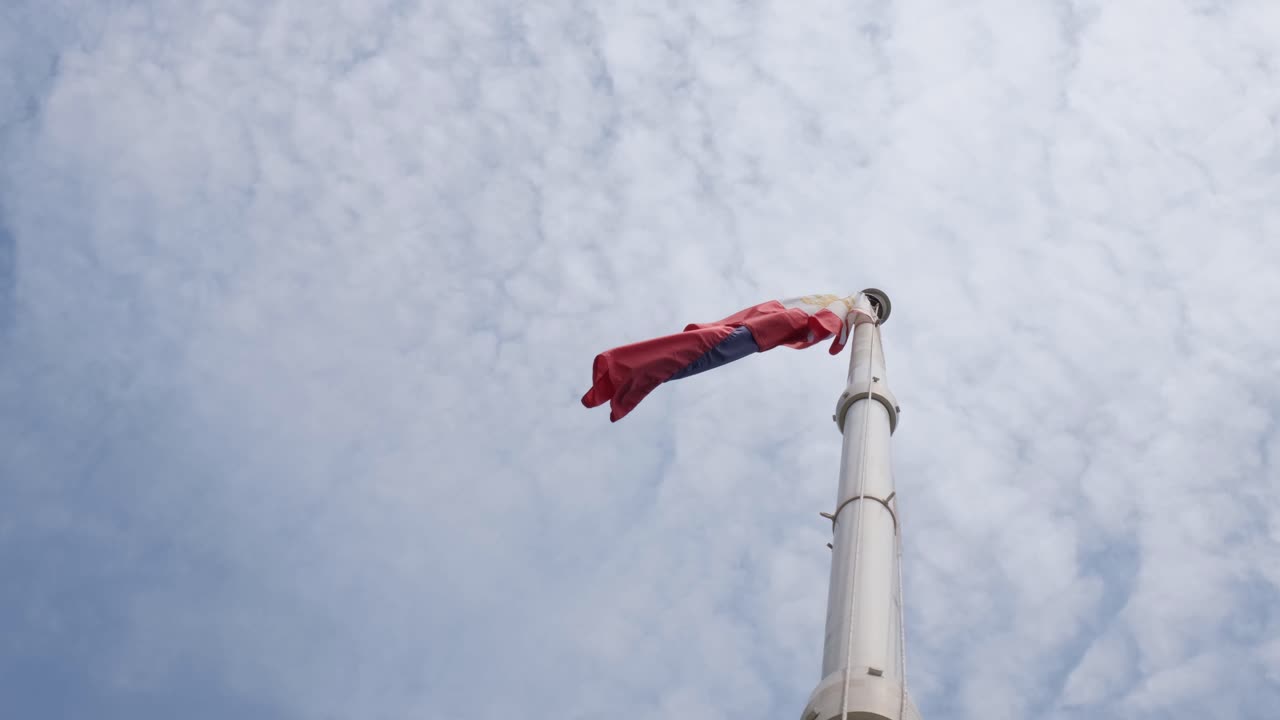 Folded while flying to the left during a cloudy day, Philippine Flag