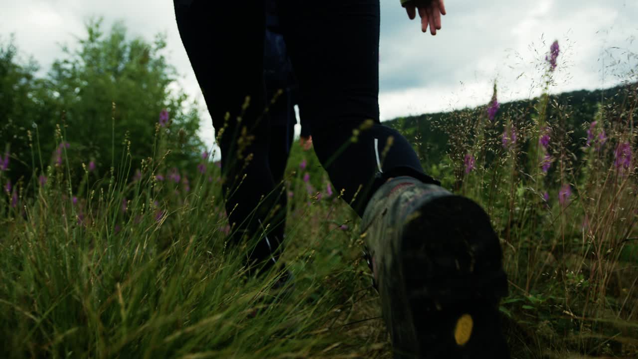 Close Up of a Woman's Feet while she is Hiking. Walking around in Nature. Two Women Hiking through German Landscape.