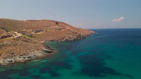 Aerial-forwards-over-mediterranean-landscape-with-ocean-and-horizon-in-background