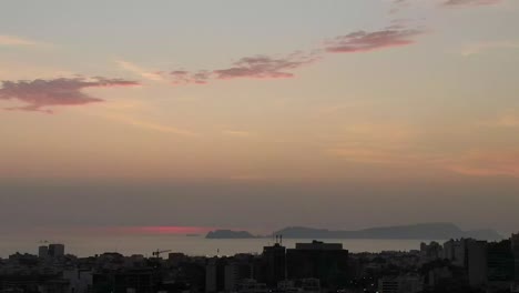 soft pink timelapse cityscape from miraflores looking to san lorenzo island, sunset