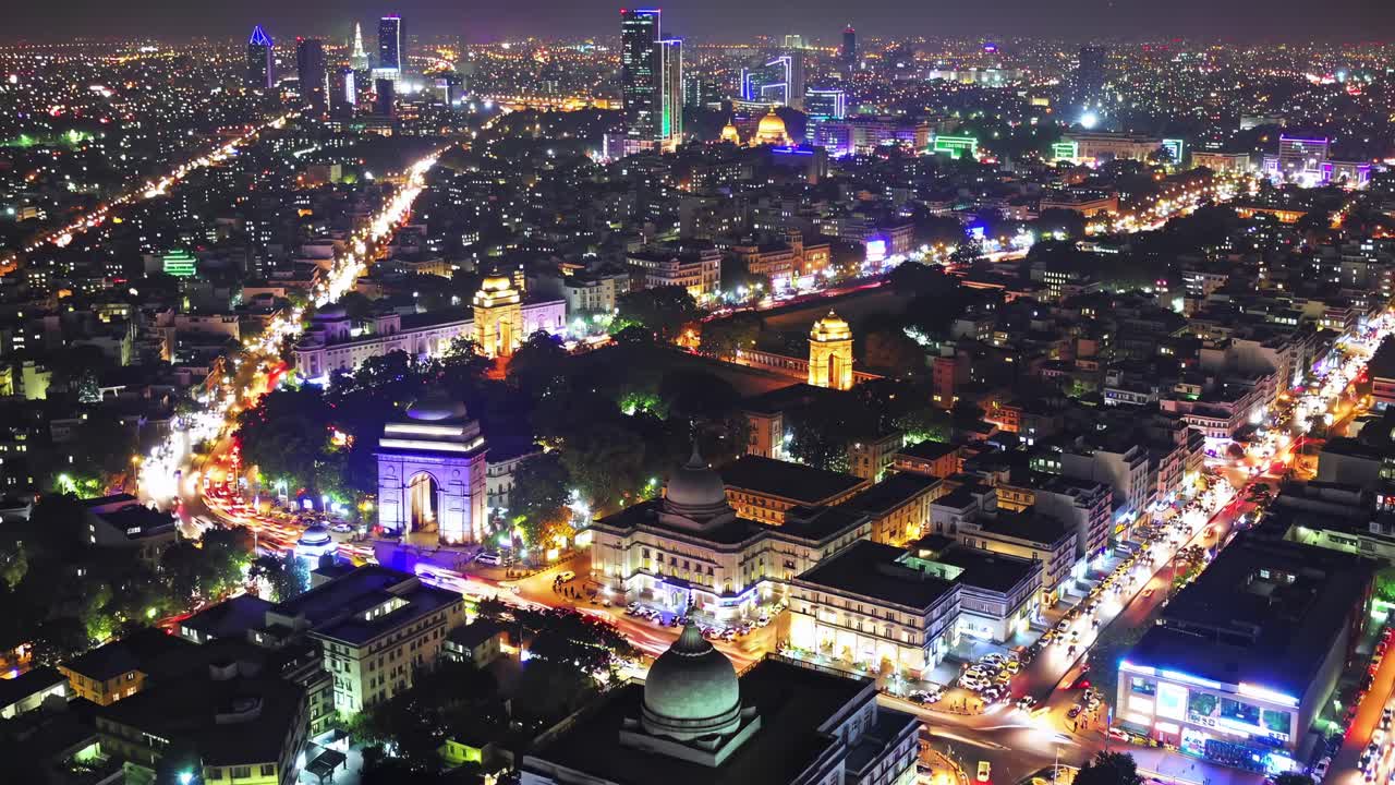 Aerial night view of a vibrant cityscape with illuminated streets and buildings