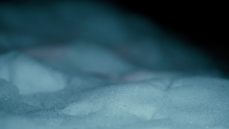 cinematic close up of a snow during a cold winter night in slow motion shot in 4k