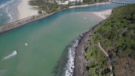 Drone-Flying-Towards-Rocky-Coastal-Headland-Of-Burleigh-Head-National-Park-In-Gold-Coast,-Queensland,-Australia
