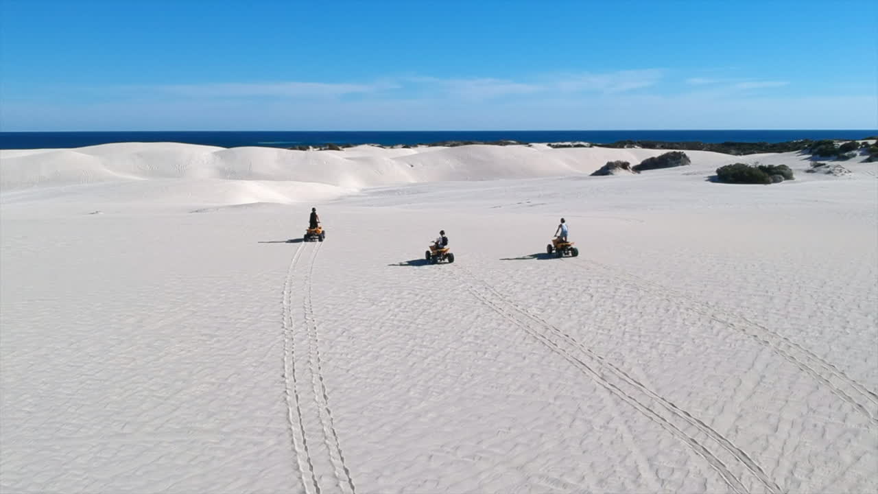 Quad in desert sand lancelin dune horizon 4k drone