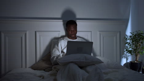 young tired man on bed