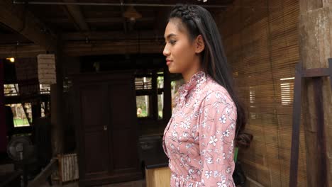 young woman in traditional southeast asian clothing