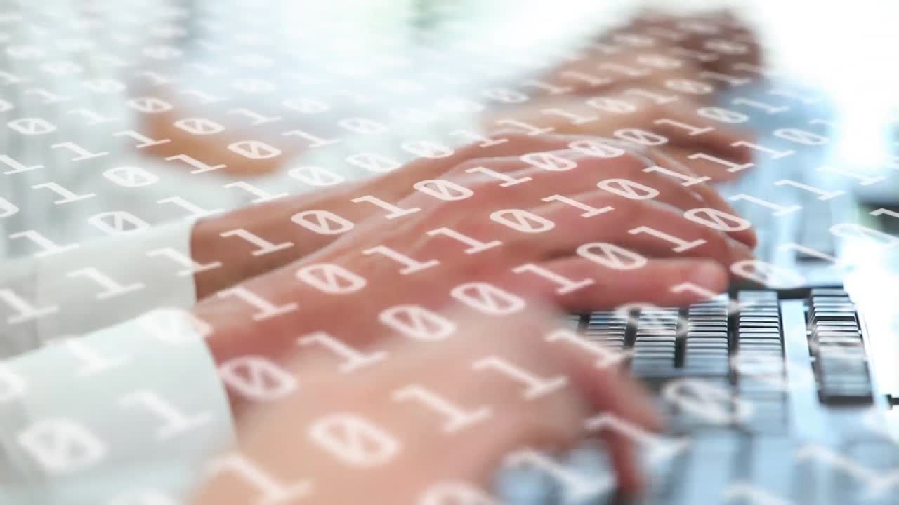 Animation of binary coding numbers changing with people typing on computer keyboard