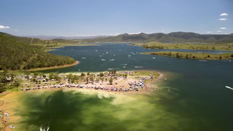 aerial parallax view of busy coastline at lake somerset in queensland