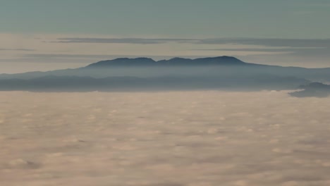 mountain range above the clouds