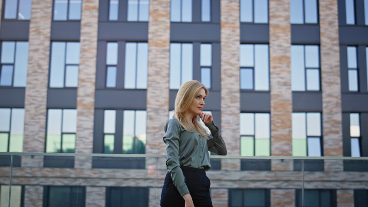 Blonde manager contemplating city alone. Thinking ceo dreaming future pondering