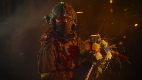 soldier holding flowers at night