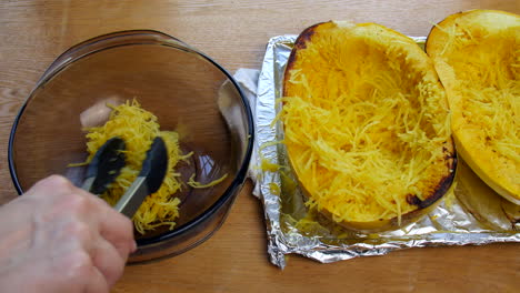 Spaghetti-squash-being-put-into-a-bowl