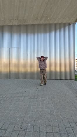 young urban dancer performing modern choreography in public space