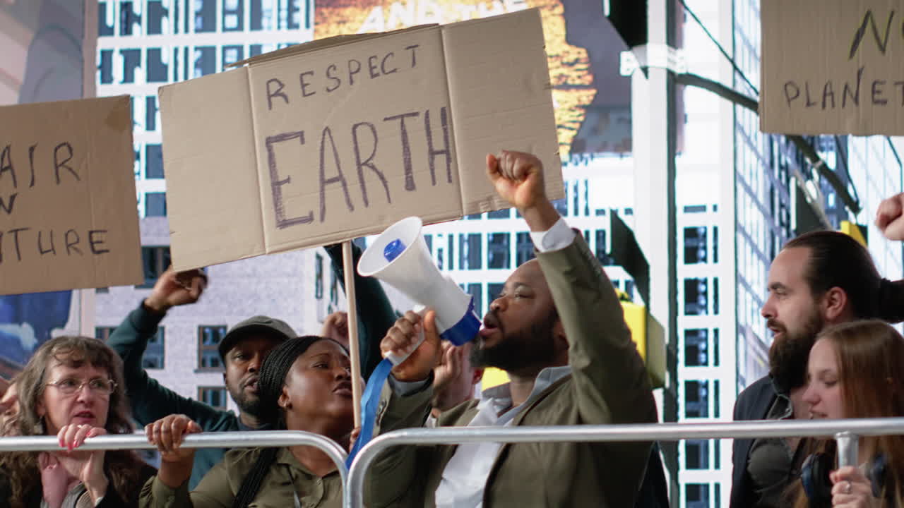Protesters and demonstrators gather in a large environmental rally