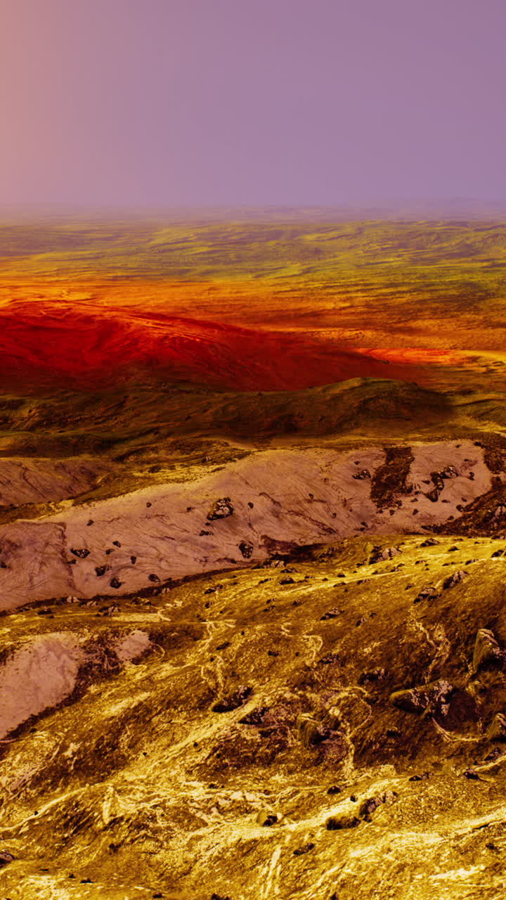 vista aérea de una cordillera con colinas rojas al atardecer