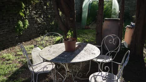 beautiful garden in the summer, relaxing calm atmosphere table and chairs outdoor