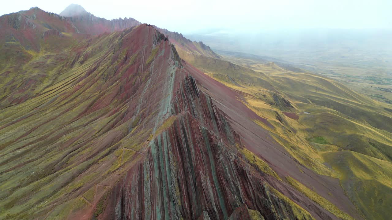 4K drone footage over the southern Andes as rainfall sweeps through Peru’s Red Mountains. A moody, cinematic scene of nature’s drama at altitude