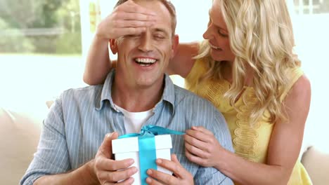 Happy-mature-couple-with-a-gift-box