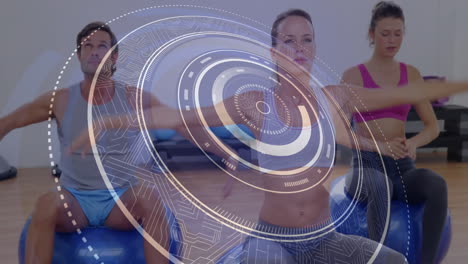 digital interface animation over people exercising with stability balls in gym