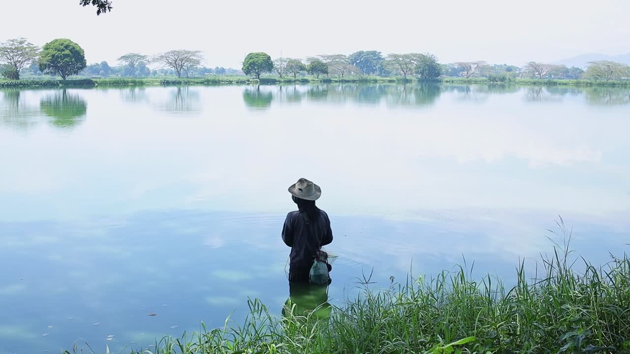 Fisherman checking the conditions around the lake on the daylight