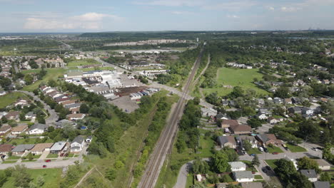 Aerial-pedestal-rising-above-large-intersection-cutting-through-open-suburb-land