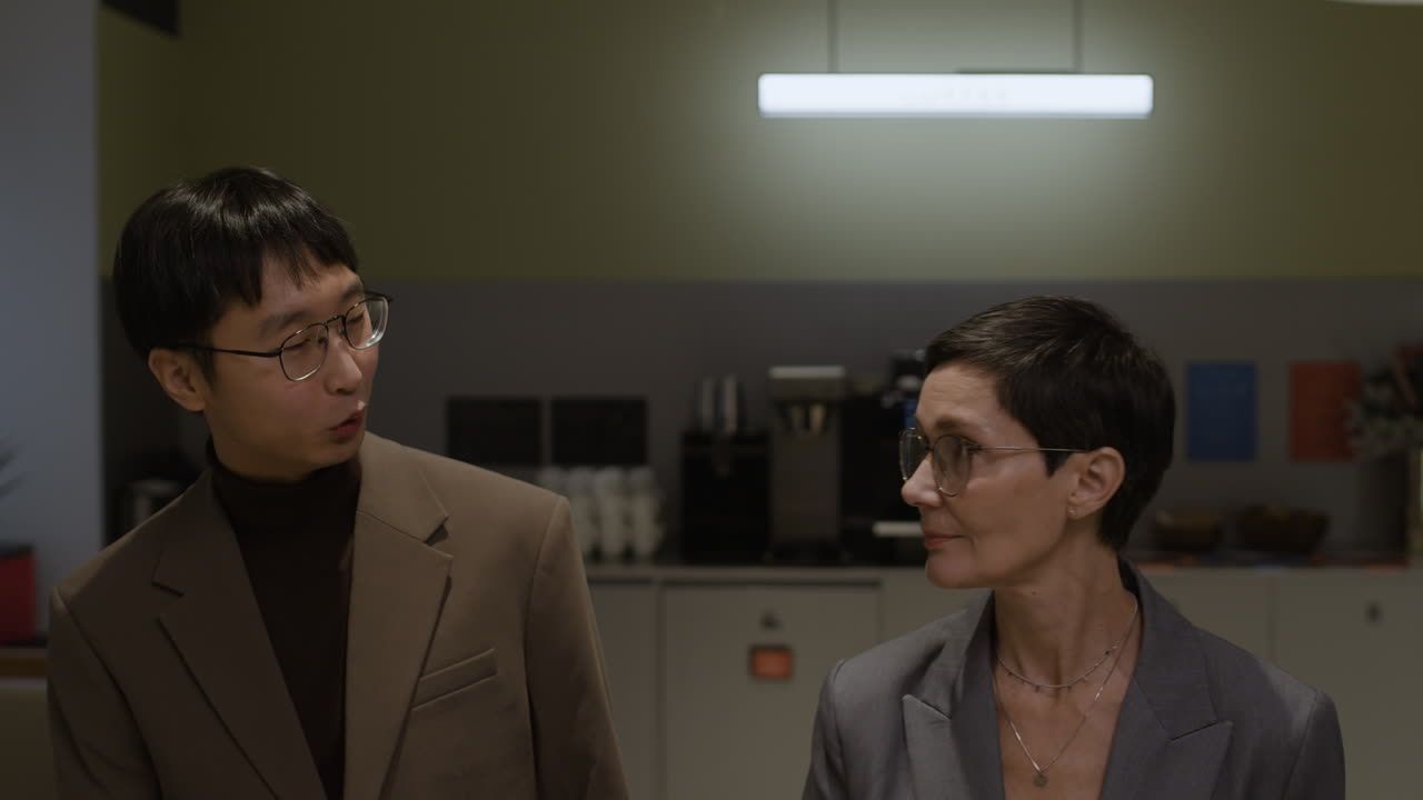 Business professionals shaking hands during a meeting