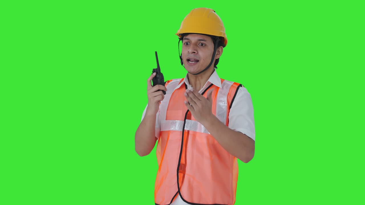 Angry Indian architect shouting on walkie talkie Green screen