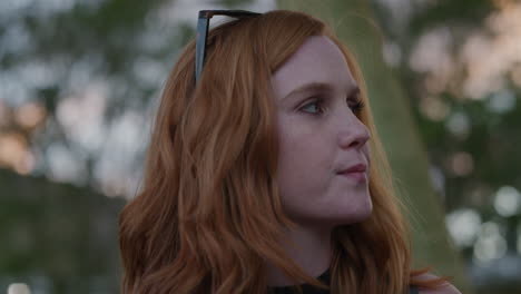 close-up-portrait-beautiful-young-red-head-woman-looking-bored-waiting-outdoors-alone-slow-motion