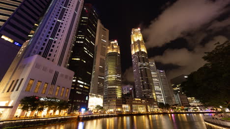 singapore - 5 march 2025 : timelapse of the singapore central business district skyline reflected in the river at night