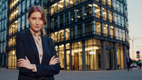 business woman in front of modern office building