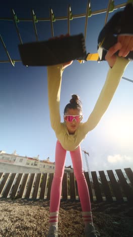 woman exercising with resistance bands in a park