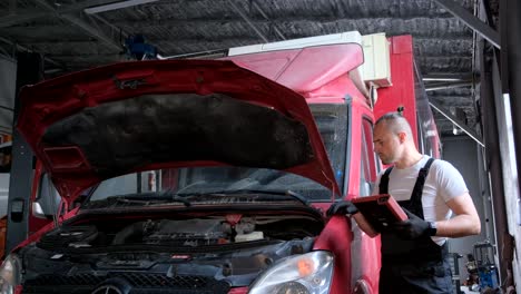 mechanic diagnosing a van in an auto repair shop